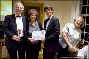 Sam presents Ann and John with the Vic Treen Trophy